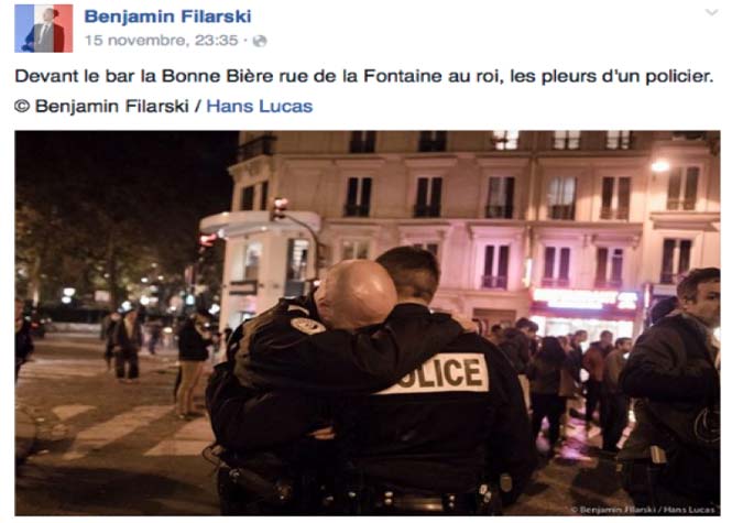 Attentats de Paris : La photo d'un policier submergé par l'émotion 
